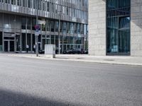 a bike in front of an office building and another building behind it with buildings on either side