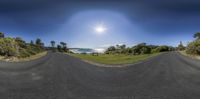 360 - generated image of a wide open beach side park road in a country setting