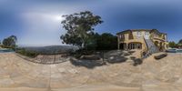 a fish eye view of a house on a clear day of the day with a pool