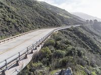 the road goes down through the mountainside on its own bike route from santa barbara to the pacific ocean