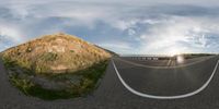 two panorama images of a straight road in a mountainous area with a sun shining on a small hill