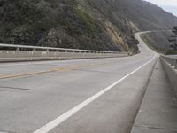 the highway is next to the cliff on this day to take in the view of the coast