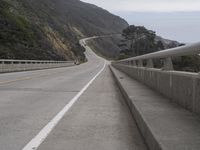 the highway is next to the cliff on this day to take in the view of the coast