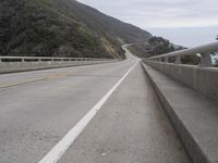 the highway is next to the cliff on this day to take in the view of the coast