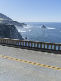 the bridge is designed to cross over the ocean as if there are cliffs at its end