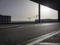 Black-and-white asphalt road surface under sunlight