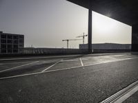 Black-and-white asphalt road surface under sunlight