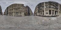 a three by four view of a building on the street outside with cobblestones