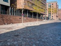 the large building is made of concrete and has metal railings around it, which are made of brick