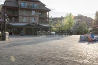 a blue chair is set on the square with the buildings behind it in front of them