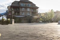 a blue chair is set on the square with the buildings behind it in front of them