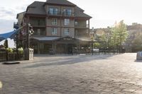 a blue chair is set on the square with the buildings behind it in front of them