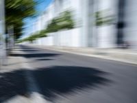 the view from behind of an umbrella that appears to be blurred with traffic in this photo