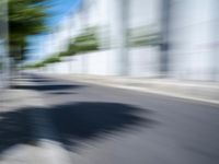 the view from behind of an umbrella that appears to be blurred with traffic in this photo