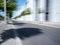 the view from behind of an umbrella that appears to be blurred with traffic in this photo