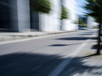 the view from behind of an umbrella that appears to be blurred with traffic in this photo