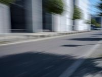 the view from behind of an umbrella that appears to be blurred with traffic in this photo