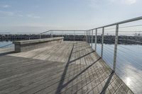 a wooden dock near the ocean in the day time - stock photo - images and pictures