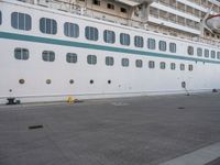 the large cruise ship is docked in the dock for passengers to board or leave the area