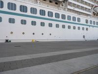 the large cruise ship is docked in the dock for passengers to board or leave the area