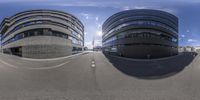 two buildings are shown from the same angle on a street intersection as they form curves