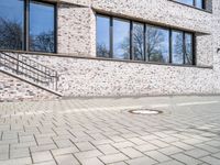 Bremen city urban architecture with modern brick building and wooden flooring on road surface