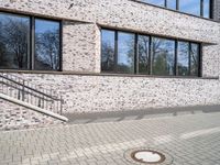 Bremen city urban architecture with modern brick building and wooden flooring on road surface