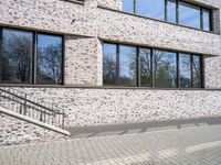 Bremen city urban architecture with modern brick building and wooden flooring on road surface