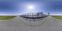 fisheye view of a baseball field from behind the fence as seen from a low point of view