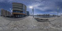 an image of a building that is taken in this 360 - shot mirror picture of a street