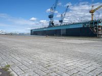 an image of a dock near a big ship in the water in front of a dock