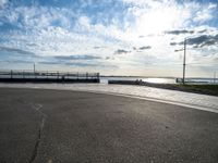 this is an image of a street and water view from the side of a highway