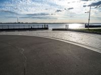 this is an image of a street and water view from the side of a highway