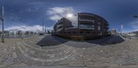 360 - lensing of the front of a modern apartment building in an open space