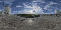 fish eye lens with the sky, street and buildings in the background at an urban park