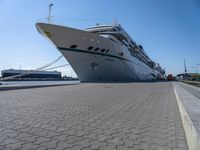 Bremen Harbor Boats and Cruise Ship on Asphalt Road in Bremerhafen, Germany