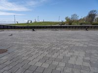 an empty plaza in a deserted place with no people standing around it and a cloudy sky