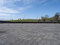 an empty plaza in a deserted place with no people standing around it and a cloudy sky