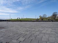 an empty plaza in a deserted place with no people standing around it and a cloudy sky