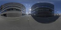 a photo showing two different buildings on a street in london taken with an hd camera