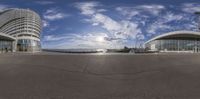 a panoramic view shows a view of two modern buildings on a beach area