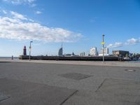 a view of the skyline of the city from a parking lot in front of a tall building