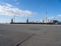 a view of the skyline of the city from a parking lot in front of a tall building