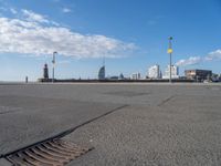 a view of the skyline of the city from a parking lot in front of a tall building