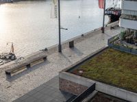 a ship on the water at a marina with several grass on it's roof