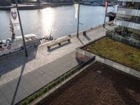 a ship on the water at a marina with several grass on it's roof