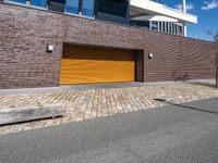 a red fire hydrant in front of a brick building with orange garage doors in front