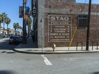 the storefront of a brick store is shown here in this picture taken on a street corner