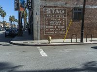 the storefront of a brick store is shown here in this picture taken on a street corner