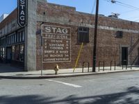 the storefront of a brick store is shown here in this picture taken on a street corner